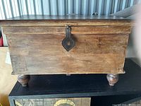 Front view showing overall chest, latch, feet