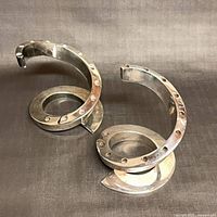 Both spiral candlesticks front view showing spiral arcs and candle holes