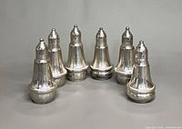 Front view of all six sterling shakers