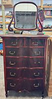 Full view showing dresser, mirror, brass pulls, harp supports, casters