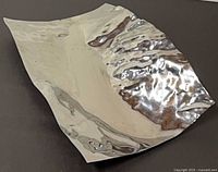 Oblique view of sculptural stainless steel dish