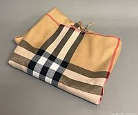 Folded Burberry check scarf showing pattern