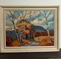 Full view of framed autumn landscape painting