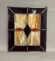 Full view of stained glass panel showing design and dimensions