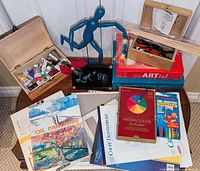 Overview of lot showing pencils, markers, paints, pyrography kit, mannequin, books, pads