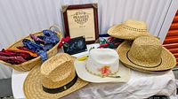 overview of hats, bandanas in basket, frame, lights