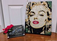 Front view of Marilyn Monroe glitter artwork with lot marker