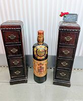 Front view showing both tower cabinets and bottle cabinet between them