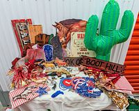 Overall view of assorted Western party items on table