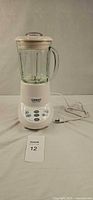 Front view of Cuisinart blender showing base, glass jar, lid, power cord