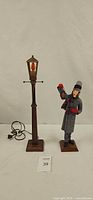 Full view of Simpich lantern man figurine and lamp post