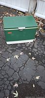 Green Coleman metal cooler closed, exterior view