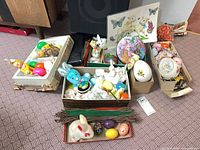 Group of boxes containing assorted Easter decor items