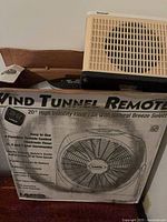 Lasko Wind Tunnel fan box with Duracraft heater resting on top
