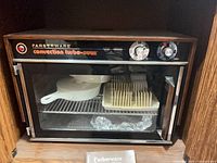 Full view of Farberware convection turbo-oven with accessories inside