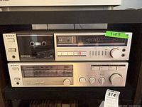 Sony TC-FX30 cassette deck and STR-VX2 receiver stacked on shelf