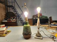 Both lamps standing, bulbs lit