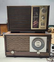 Front view of Panasonic (top) and Zenith (bottom) radios