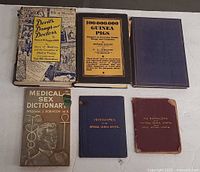 All six books laid out face up showing covers