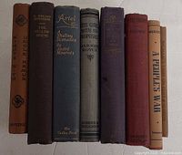 All eight book spines visible