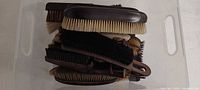 Stack of multiple clothes and shoe shine brushes