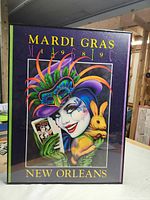 Full view of framed 1989 Mardi Gras Magic poster by Andrea Mistretta