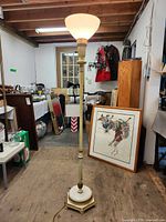 Full view of torchiere floor lamp standing in room