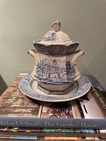 Sugar bowl with lid on matching plate, full view