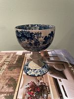 Front view of blue transferware goblet on pedestal base