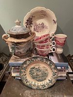 Group showing sugar bowl, bowl, four cups, and plate