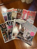 Group shot of all eight magazines fanned on floor