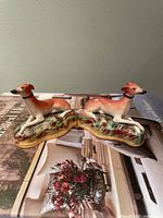 Front view of both Staffordshire dog figurines on bases