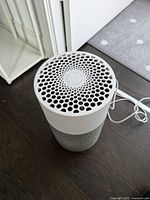 Oblique top view showing honeycomb grille and power cord