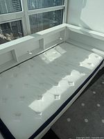 Top view showing complete white platform bed and mattress