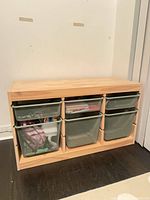 Front view showing pine frame with three small top and three large bottom mesh bins