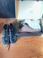 ECCO boots in box next to Nike shoes pair
