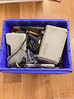 overview of bin with tool cases and mixed items
