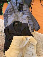 All four outerwear pieces stacked showing colors and styles