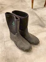 Front angled view of pair of Woods neoprene rubber boots showing overall condition and logo