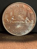 Reverse side showing canoe Voyageur design and 1978 date