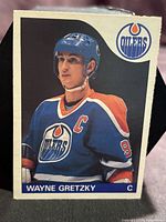 Front of 1985 O-Pee-Chee Wayne Gretzky card showing player image and Oilers logo