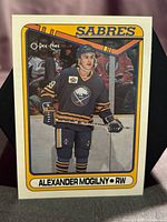 Front of 1990-91 O-Pee-Chee Alexander Mogilny rookie card showing player image and border details