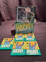 Front of display box with five sealed packs