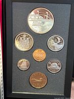 Full seven-coin proof set in insert within book-style case