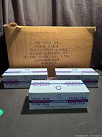 Three O-Pee-Chee vending boxes in front of shipping case