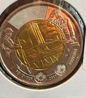 Reverse of 2017 Vimy Ridge $2 coin in holder