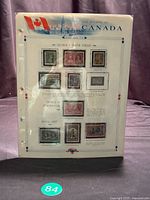 Full view of album page with ten mounted Canadian stamps