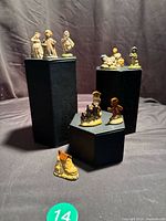 Group shot of all seven Wade Whimsies on risers