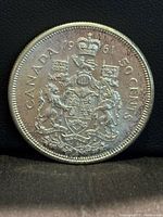 Reverse showing Canadian coat of arms, CANADA, 1961 date, 50 CENTS legend