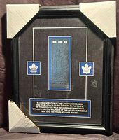 Full view of framed ticket holder gift with corner protectors